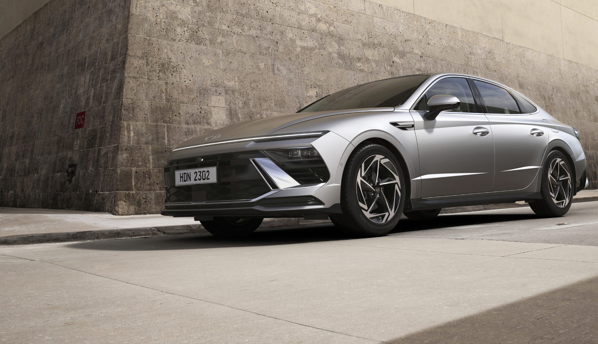 Closer view at the front part of Hyundai car with its logo and grille
